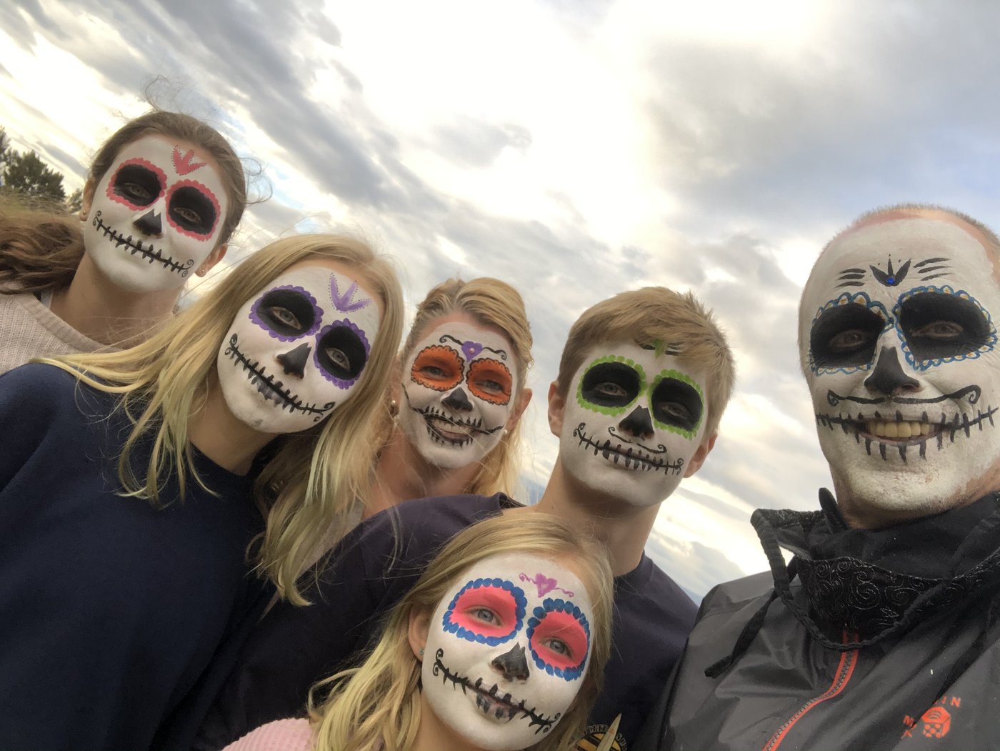 Our family in traditional face paint during a Dia de los Muertos celebration in Oaxaca