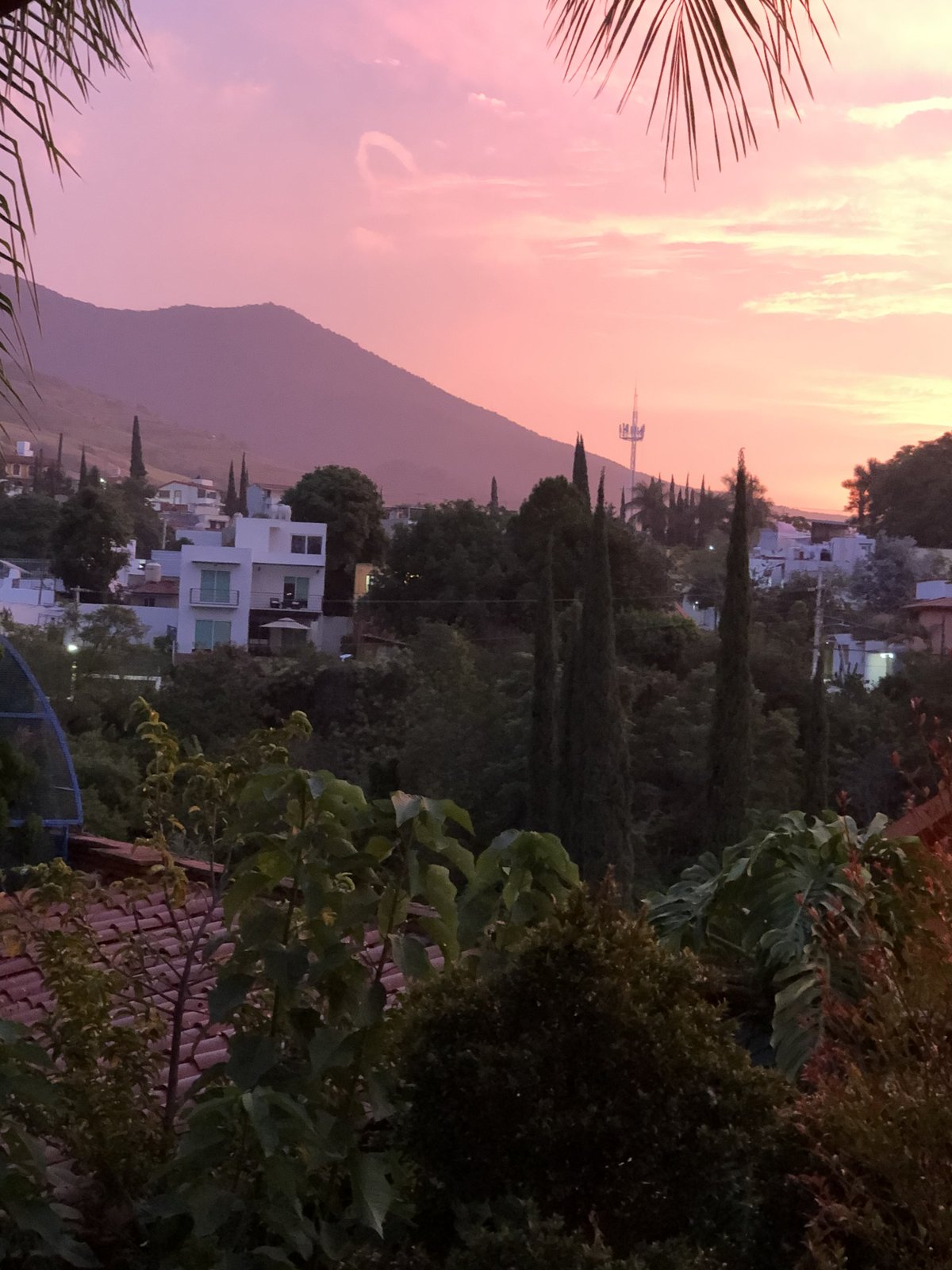 Sunset over the mountains and rooftops of Oaxaca