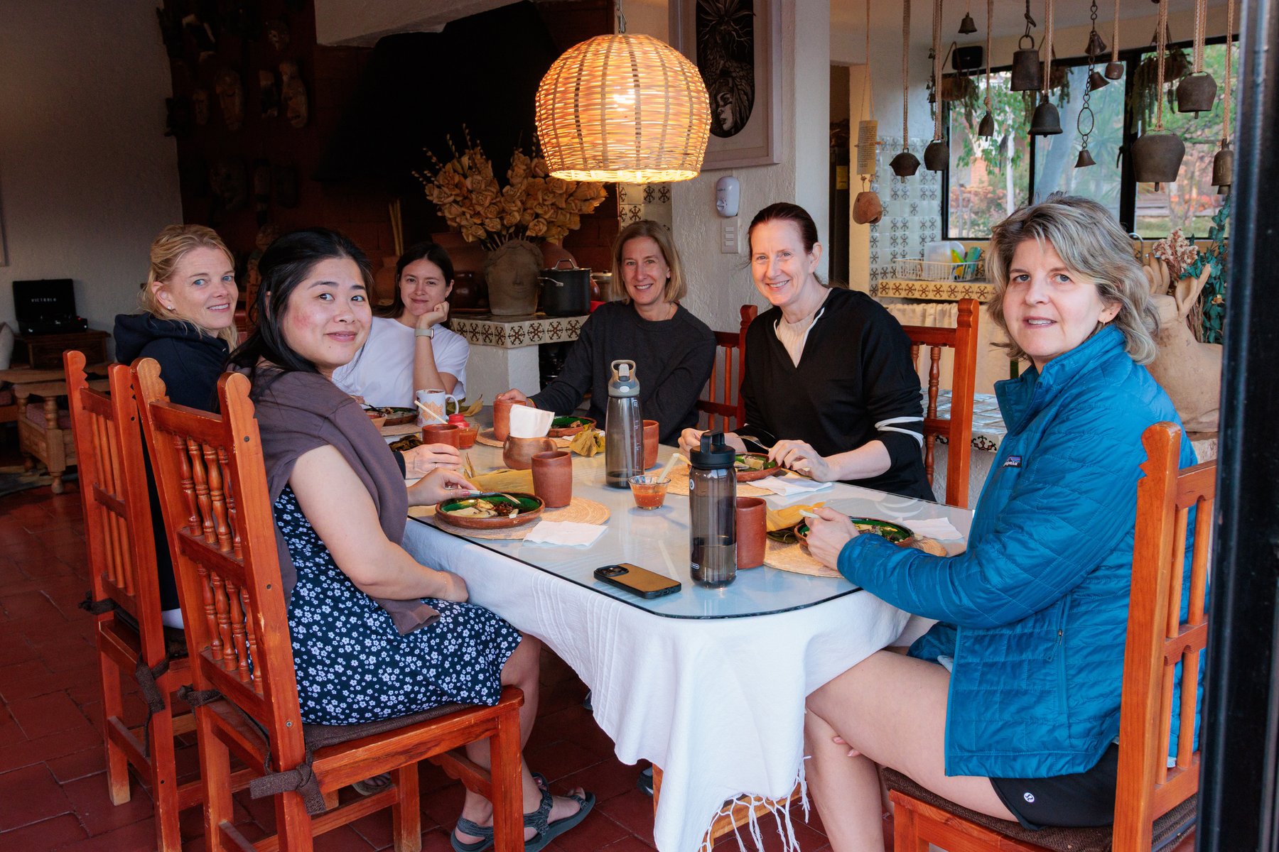 A shared dinner table set for the group