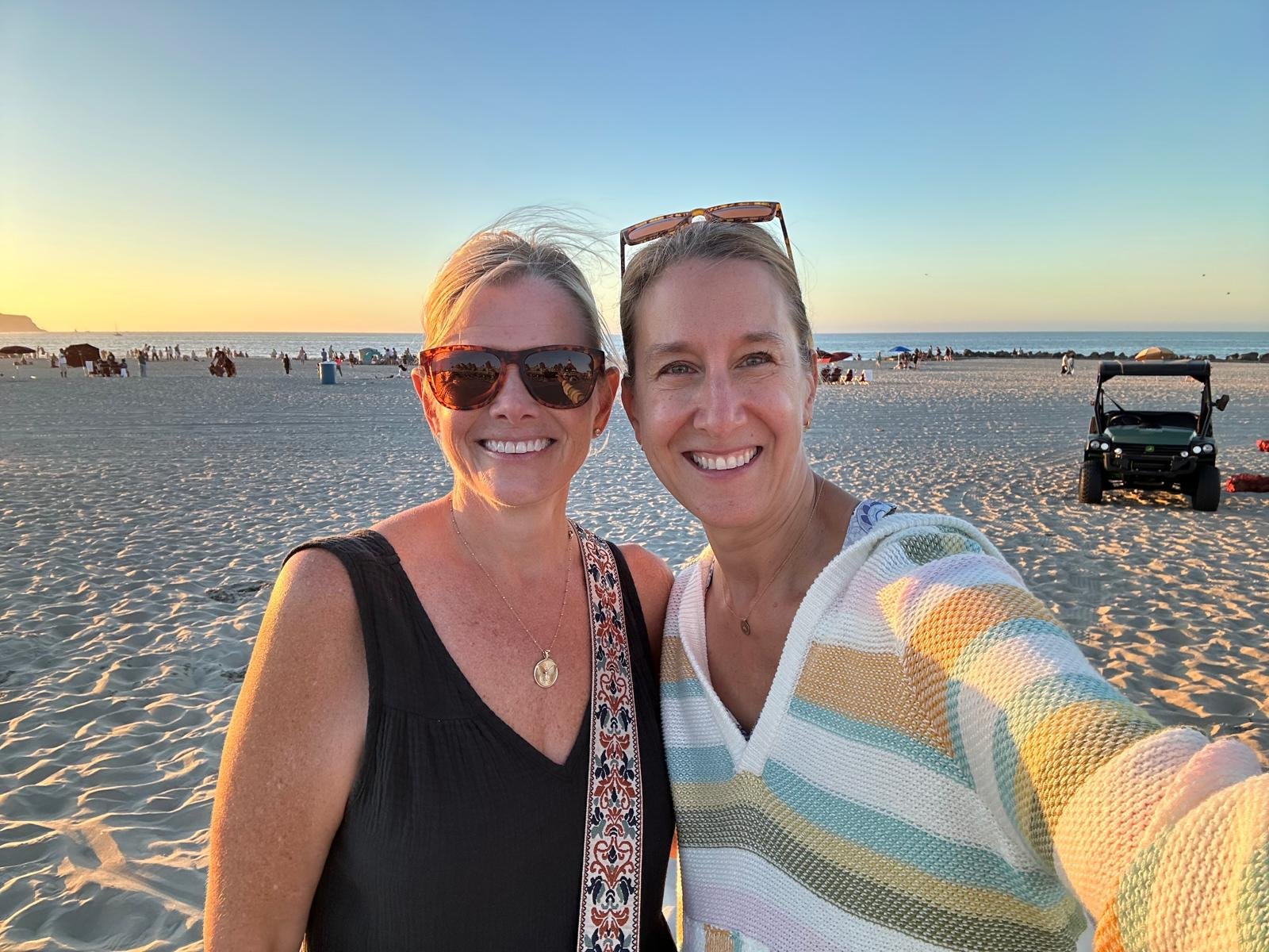 Suzanne and Kimberly on the beach at sunset