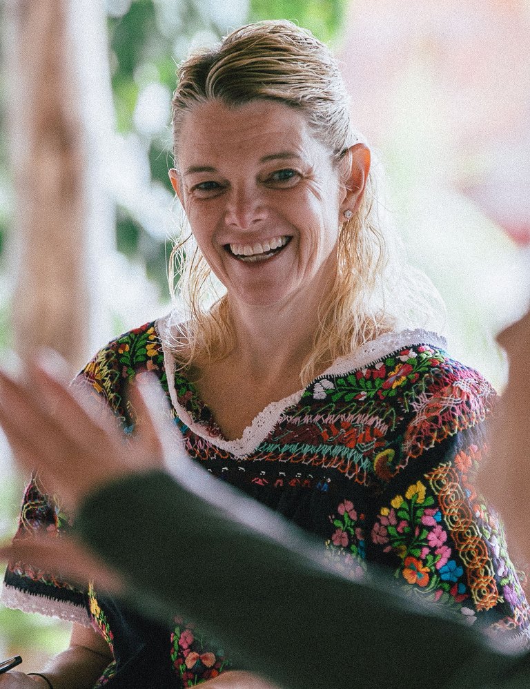 Suzanne Roske laughing mid-conversation at the retreat in Oaxaca